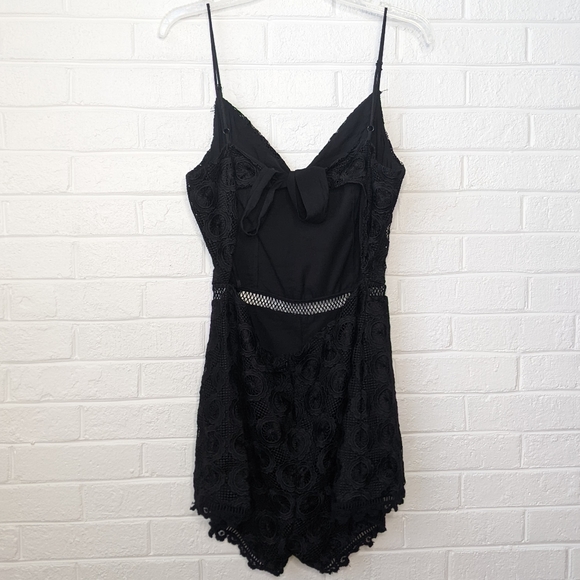 Lovers + Friends Revolve Songbird Black Crochet Lace Cut Out Tie Back Romper - Picture 4 of 6